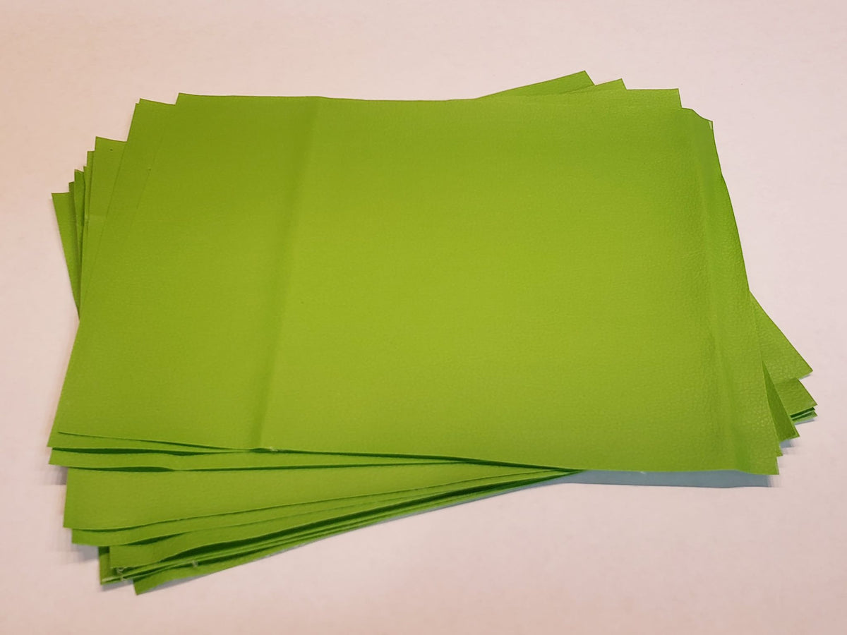 Stack of #7 kelly green faux leather sheets with a pebbled grain texture