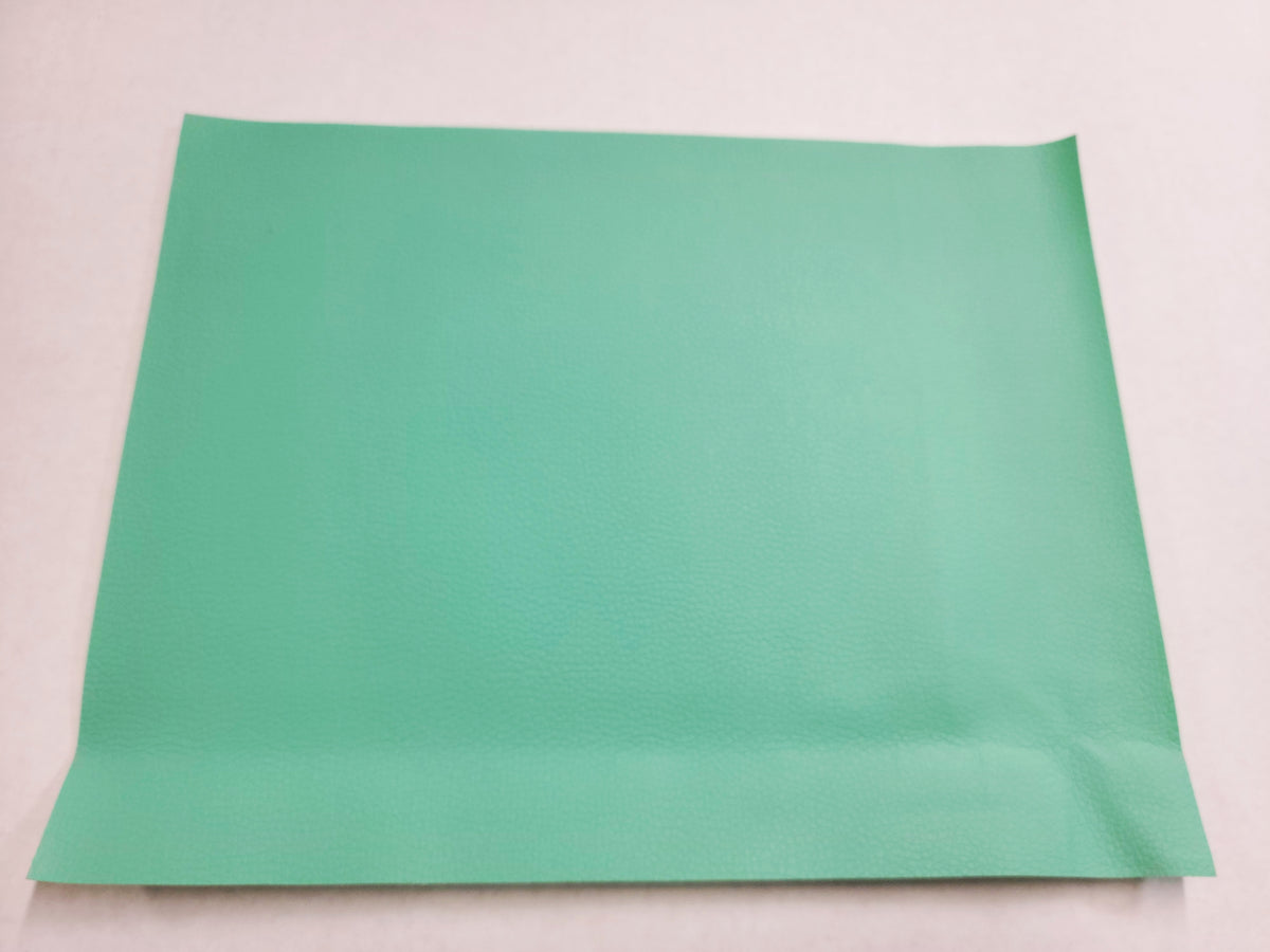 Stack of #8 turquoise green faux leather sheets with a pebbled grain texture