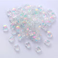 Clear 8 x 9.5mm glass bear beads with an AB shimmer on a white background