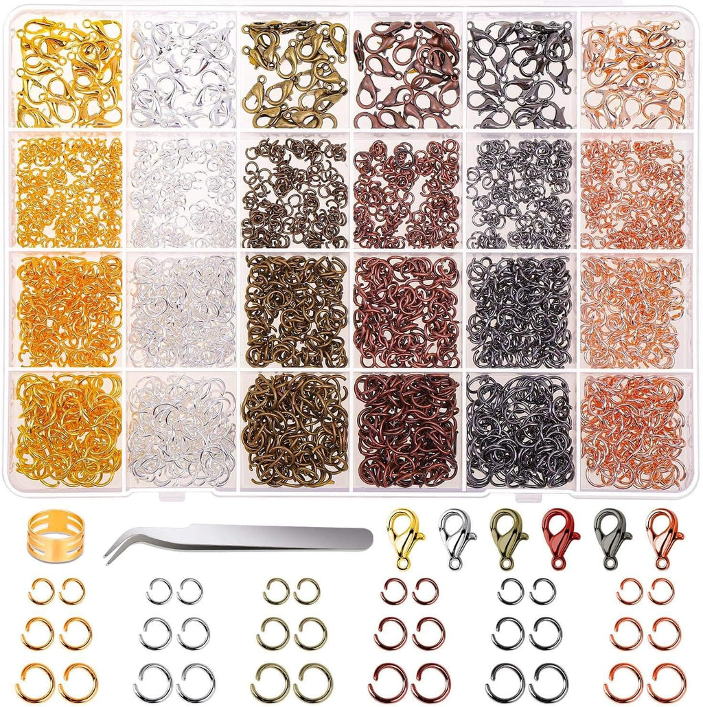 Divided case of mixed jump rings and lobster clasps in many metal colours, with tweezers and an opener