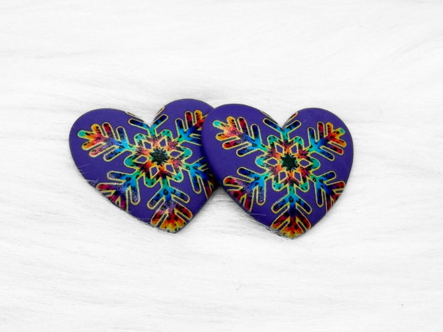 Pair of 37mm resin heart cabochons (cabs) in purple with a rainbow snowflake design
