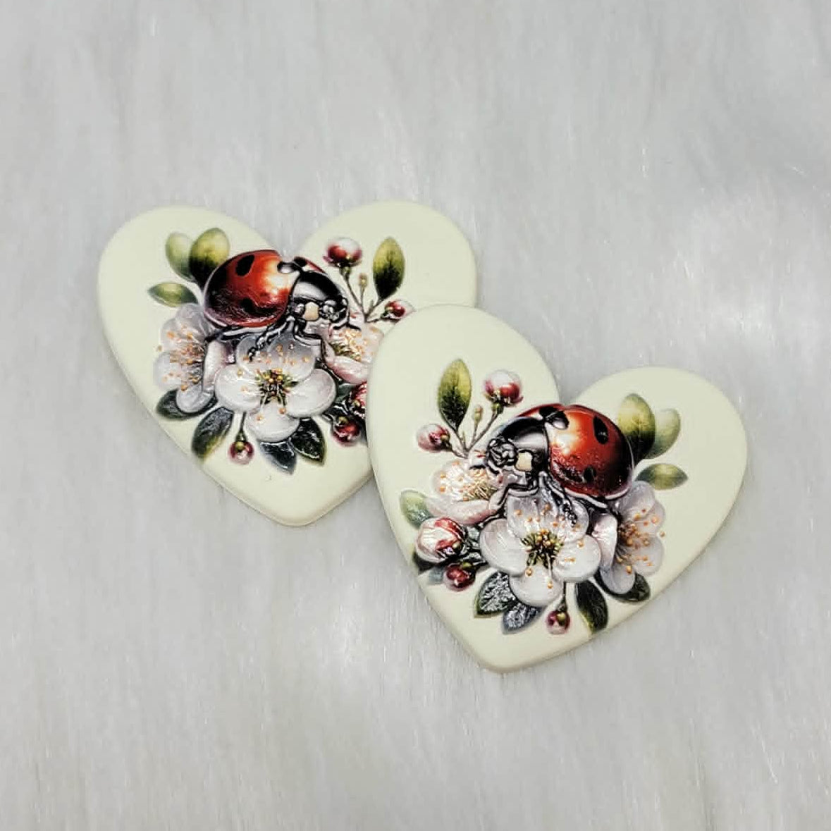 Pair of Premium 3D 37mm resin heart cabochons (cabs) in cream with a red ladybug on white blossoms