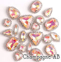 Sew-on crystal rhinestones in champagne AB, in 10 shapes with silver claw settings