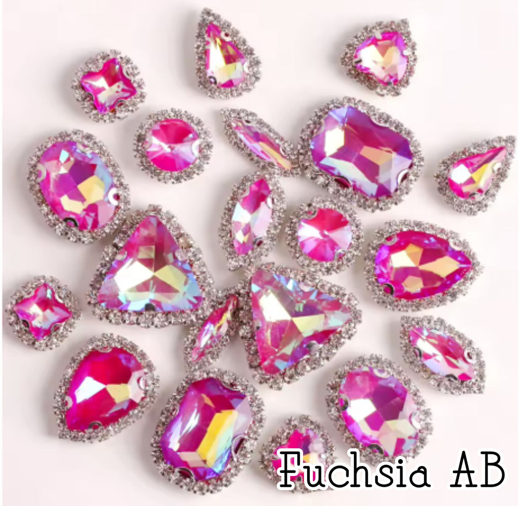 Sew-on crystal rhinestones in fuchsia AB, in 10 shapes with silver claw settings