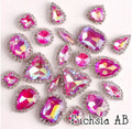 Sew-on crystal rhinestones in fuchsia AB, in 10 shapes with silver claw settings