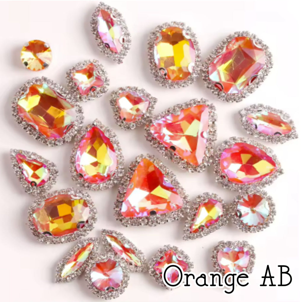 Sew-on crystal rhinestones in orange AB, in 10 shapes with silver claw settings