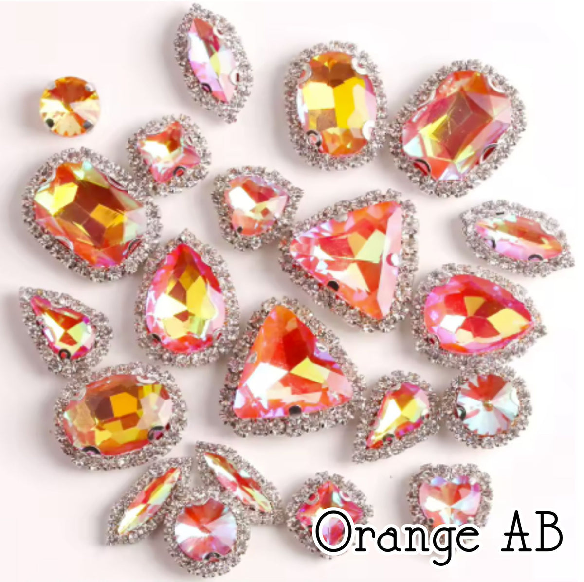 Sew-on crystal rhinestones in orange AB, in 10 shapes with silver claw settings