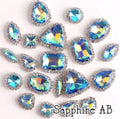 Sew-on crystal rhinestones in sapphire AB, in 10 shapes with silver claw settings