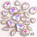 Sew-on crystal rhinestones in white AB, in 10 shapes with silver claw settings