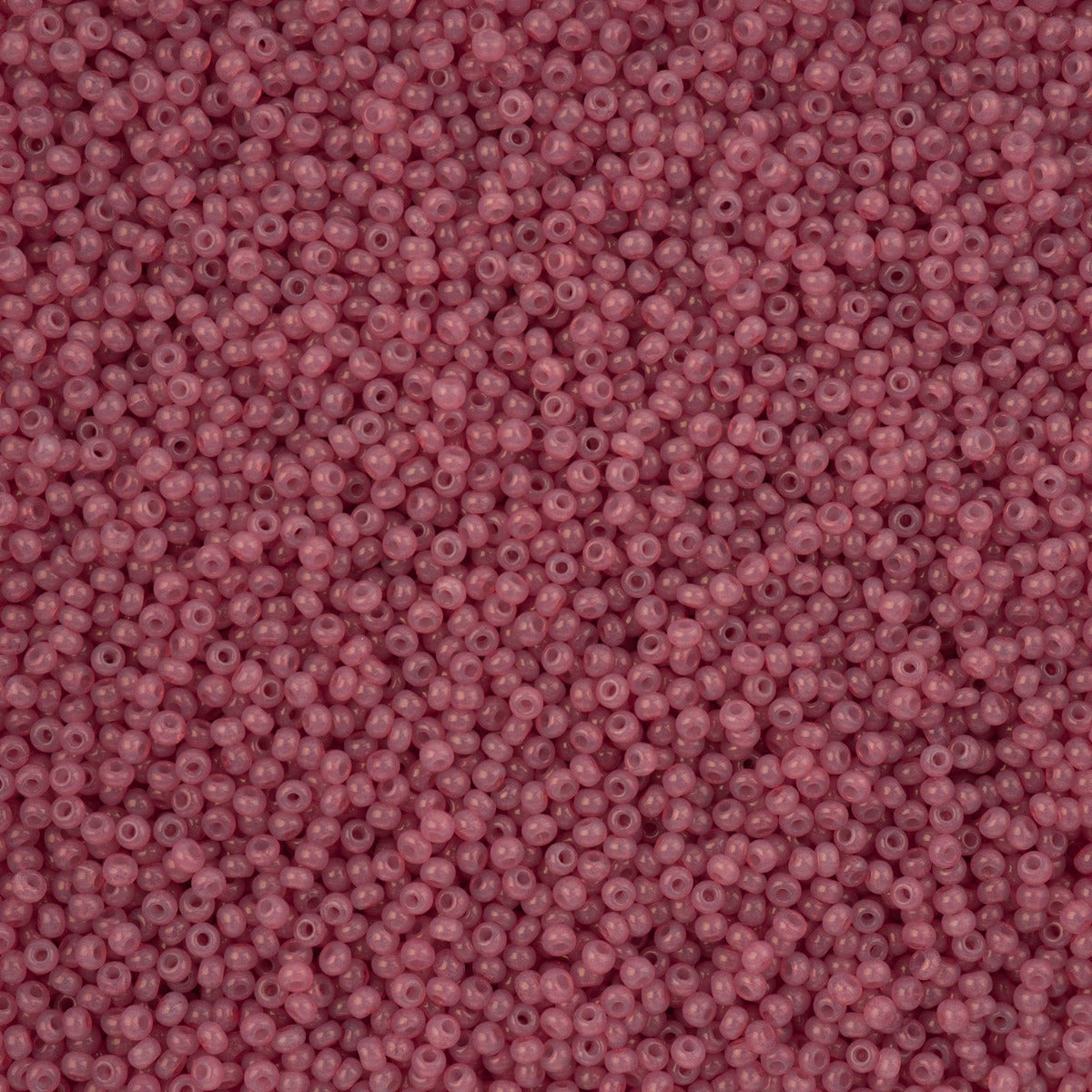 Close-up of Preciosa 11/0 Czech glass seed beads in alabaster dark pink solgel