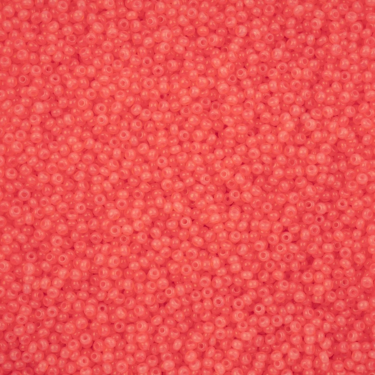 Close-up of Preciosa 11/0 Czech glass seed beads in alabaster pink solgel