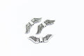 Antique silver 7 x 24mm angel wing spacer bead on a white background
