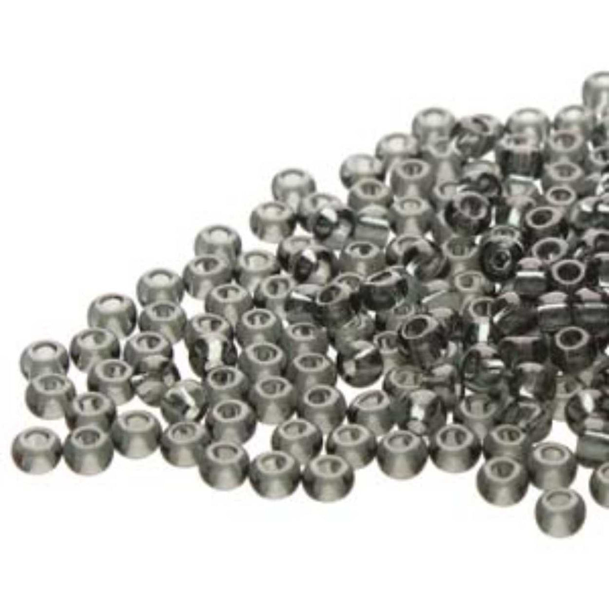 Small pile of Preciosa 11/0 Czech glass seed beads in transparent black diamond on a white background