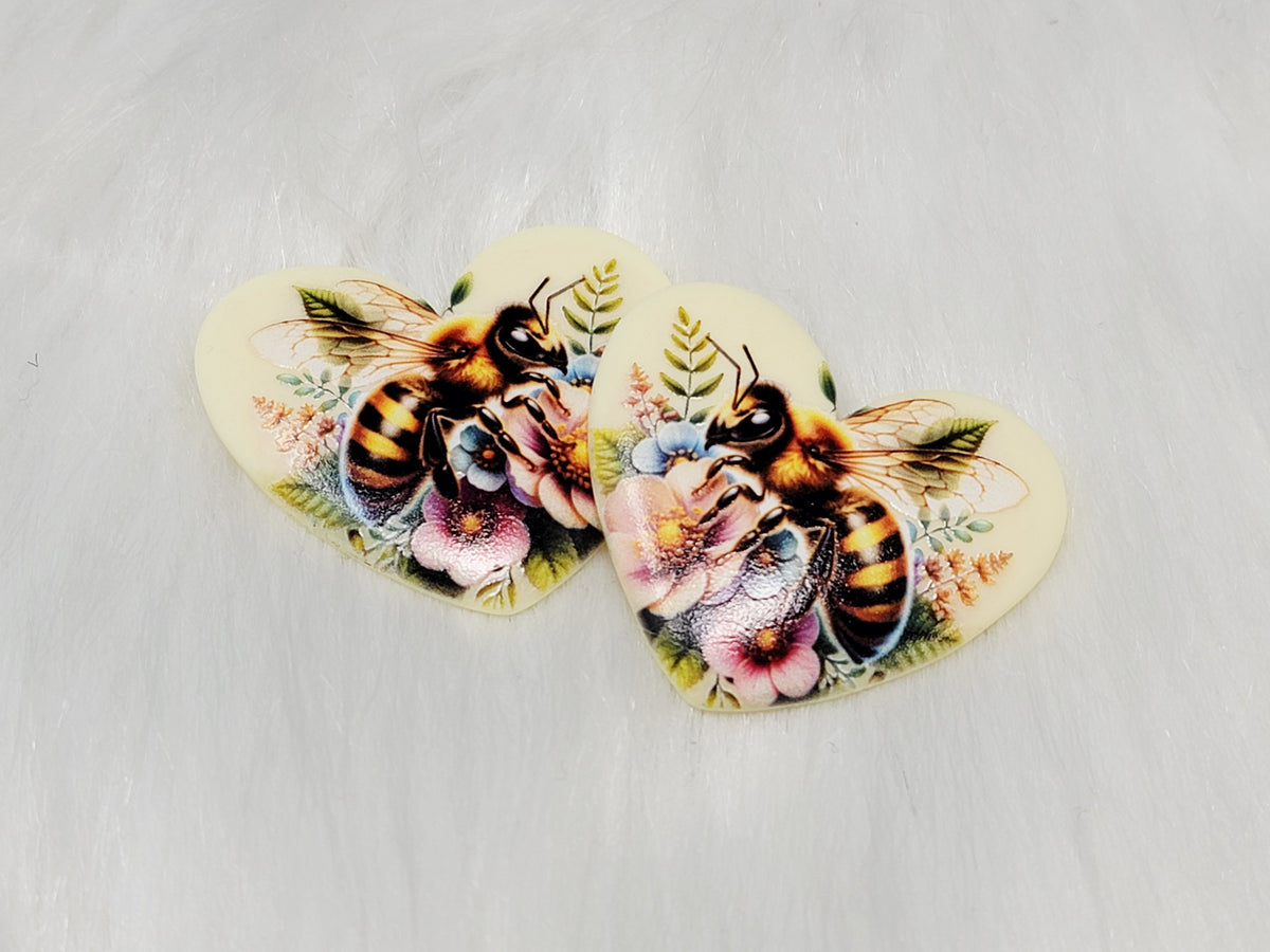 Pair of 37mm resin heart cabochons (cabs) in cream with fuzzy bees and pink and white flowers