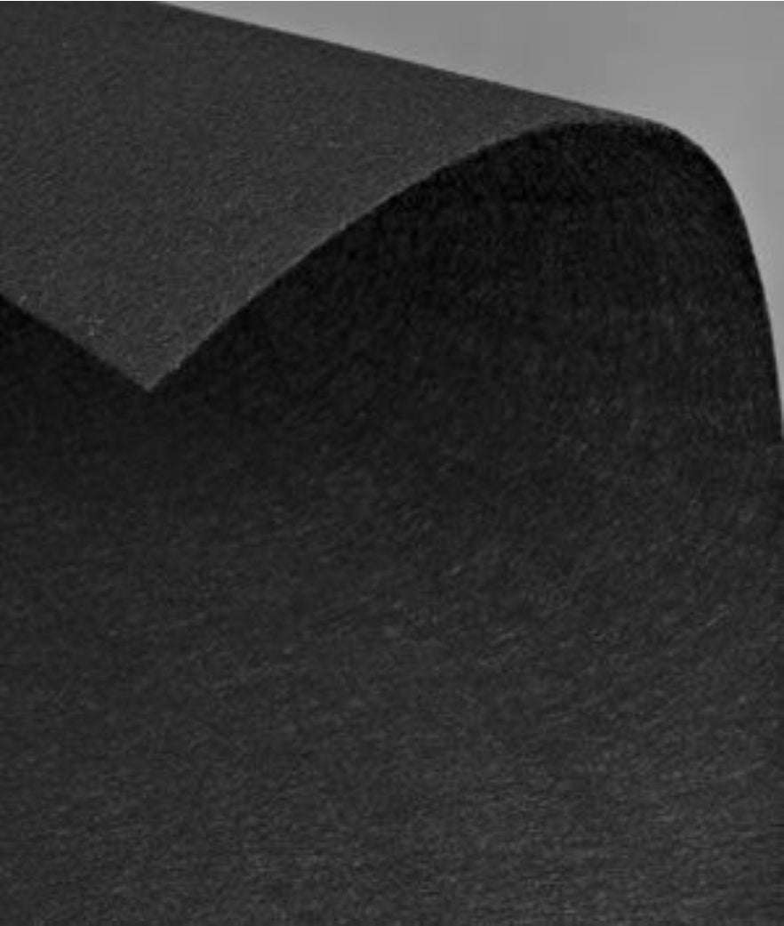 Sheet of black extra firm beading pellon curling at one corner
