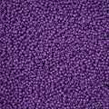 Close-up of Preciosa 11/0 Czech glass seed beads in bright grape purple chalk terra