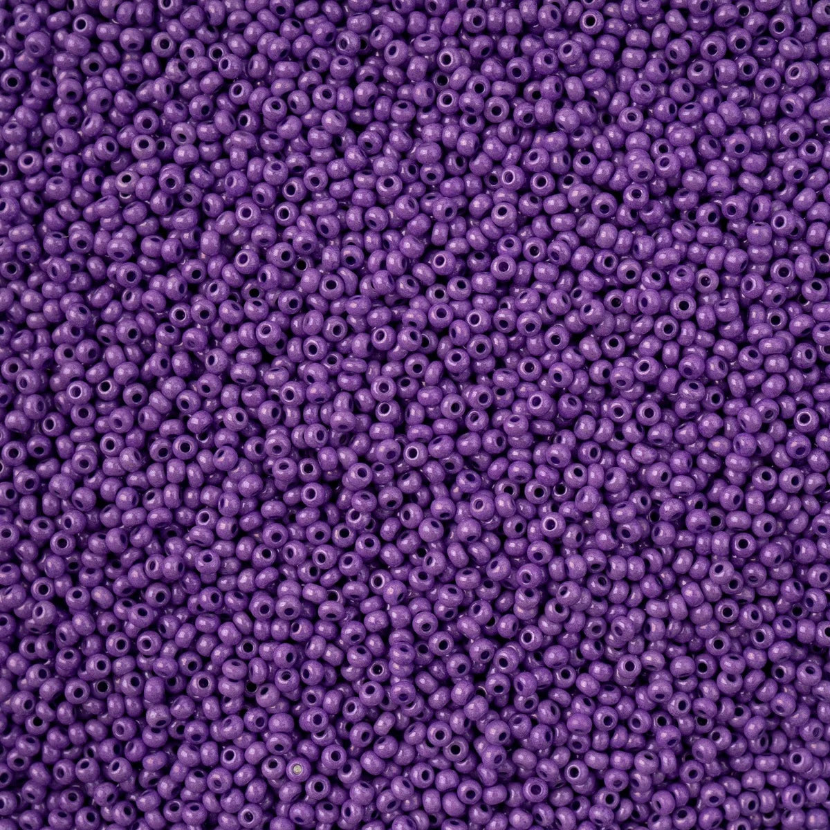 Close-up of Preciosa 11/0 Czech glass seed beads in bright grape purple chalk terra