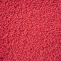 Close-up of Preciosa 11/0 Czech glass seed beads in bright pink chalk terra