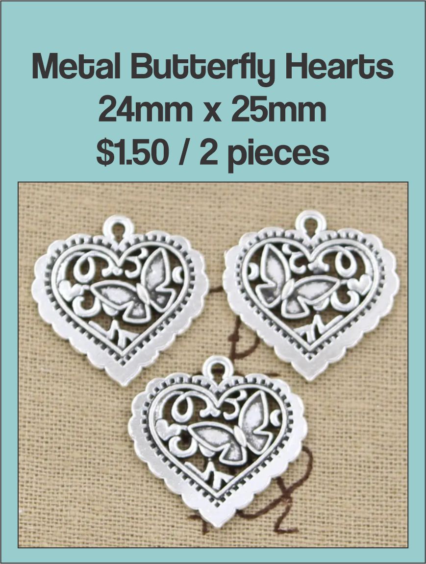Three silver-tone 24 x 25mm filigree heart charms with a butterfly cut-out
