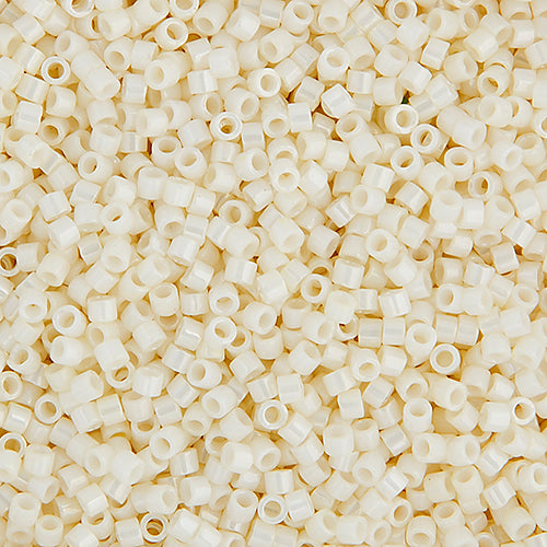 Close-up of Miyuki Delica 11/0 DB0203 cylinder beads in ceylon light yellow with an AB rainbow finish