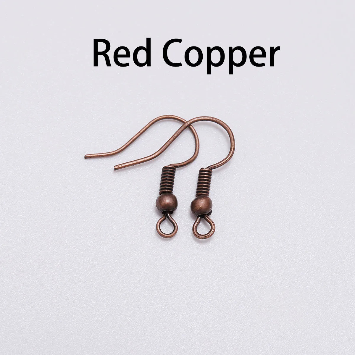 Pair of copper shepherd earring hooks with coil and bead, labelled 'Red Copper'