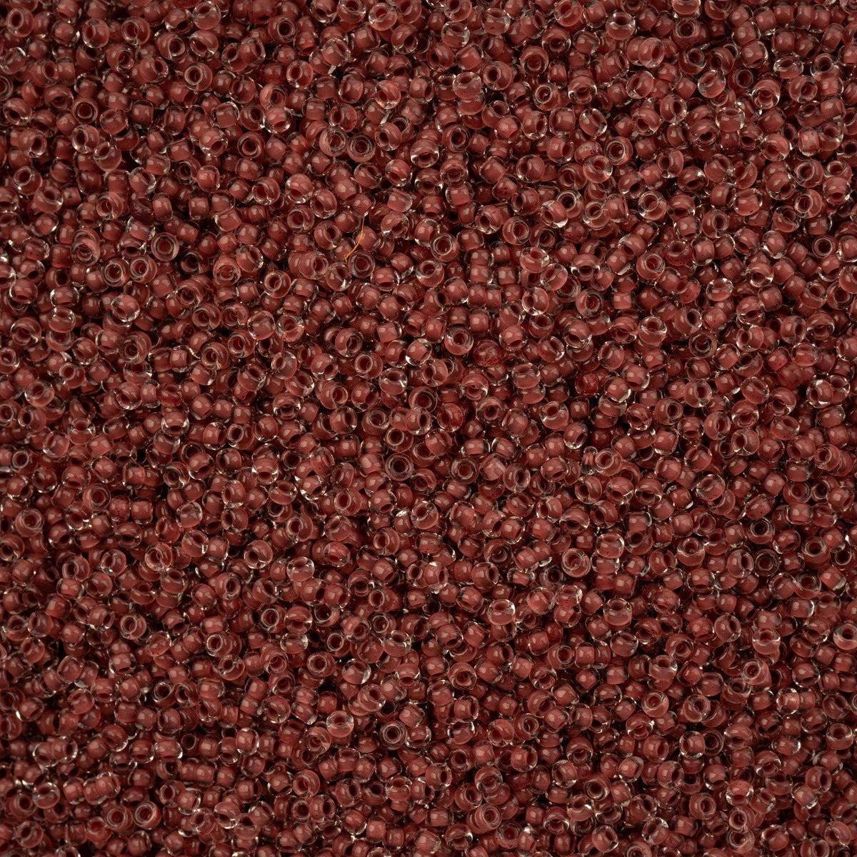 Close-up of Preciosa 11/0 Czech glass seed beads in brown colour-lined terra intensive