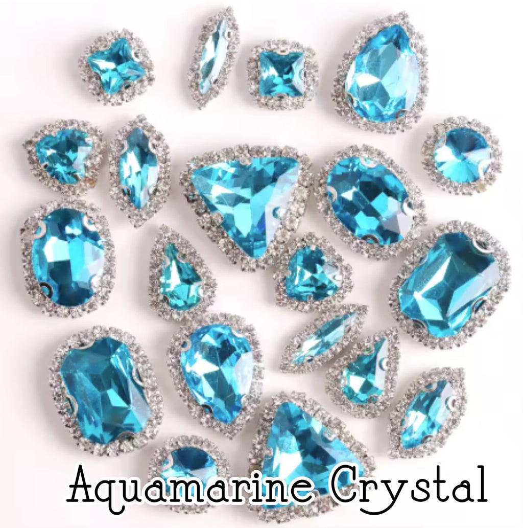 Sew-on crystal rhinestones in aquamarine crystal, in 10 shapes with silver claw settings