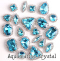 Sew-on crystal rhinestones in aquamarine crystal, in 10 shapes with silver claw settings