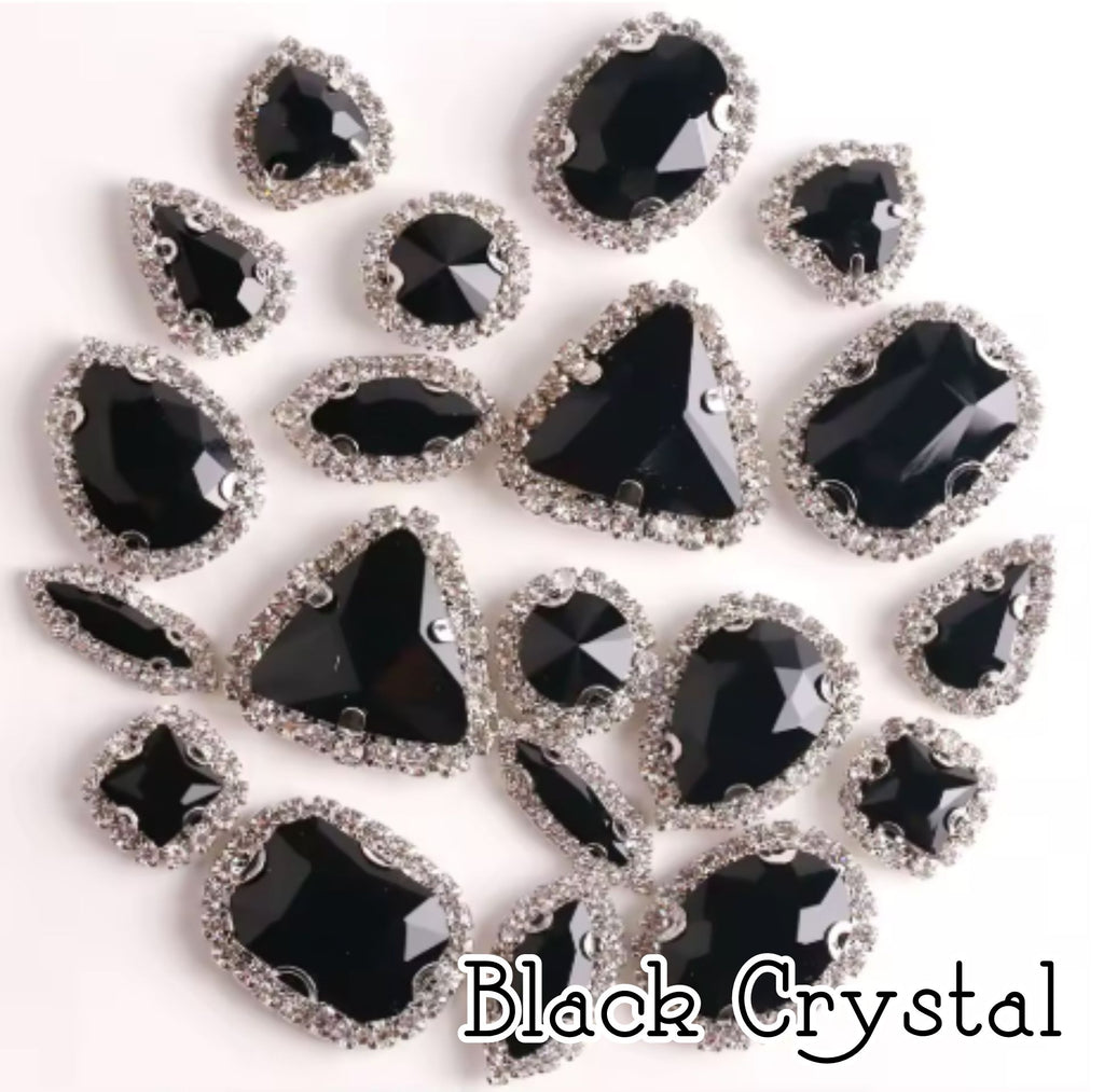 Sew-on crystal rhinestones in black crystal, in 10 shapes with silver claw settings