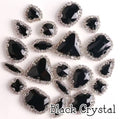 Sew-on crystal rhinestones in black crystal, in 10 shapes with silver claw settings