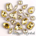 Sew-on crystal rhinestones in jonquil crystal, in 10 shapes with silver claw settings