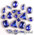 Sew-on crystal rhinestones in sapphire crystal, in 10 shapes with silver claw settings