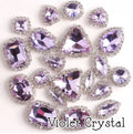 Sew-on crystal rhinestones in violet crystal, in 10 shapes with silver claw settings