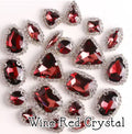 Sew-on crystal rhinestones in wine red crystal, in 10 shapes with silver claw settings