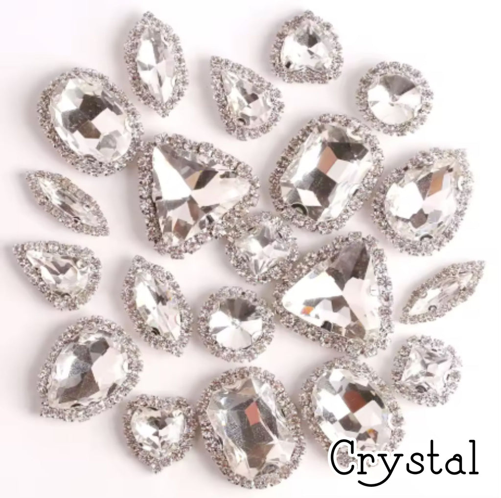 Sew-on crystal rhinestones in clear crystal, in 10 shapes with silver claw settings