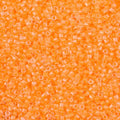 Close-up of Miyuki Delica 11/0 DB2033 cylinder beads in luminous creamsicle
