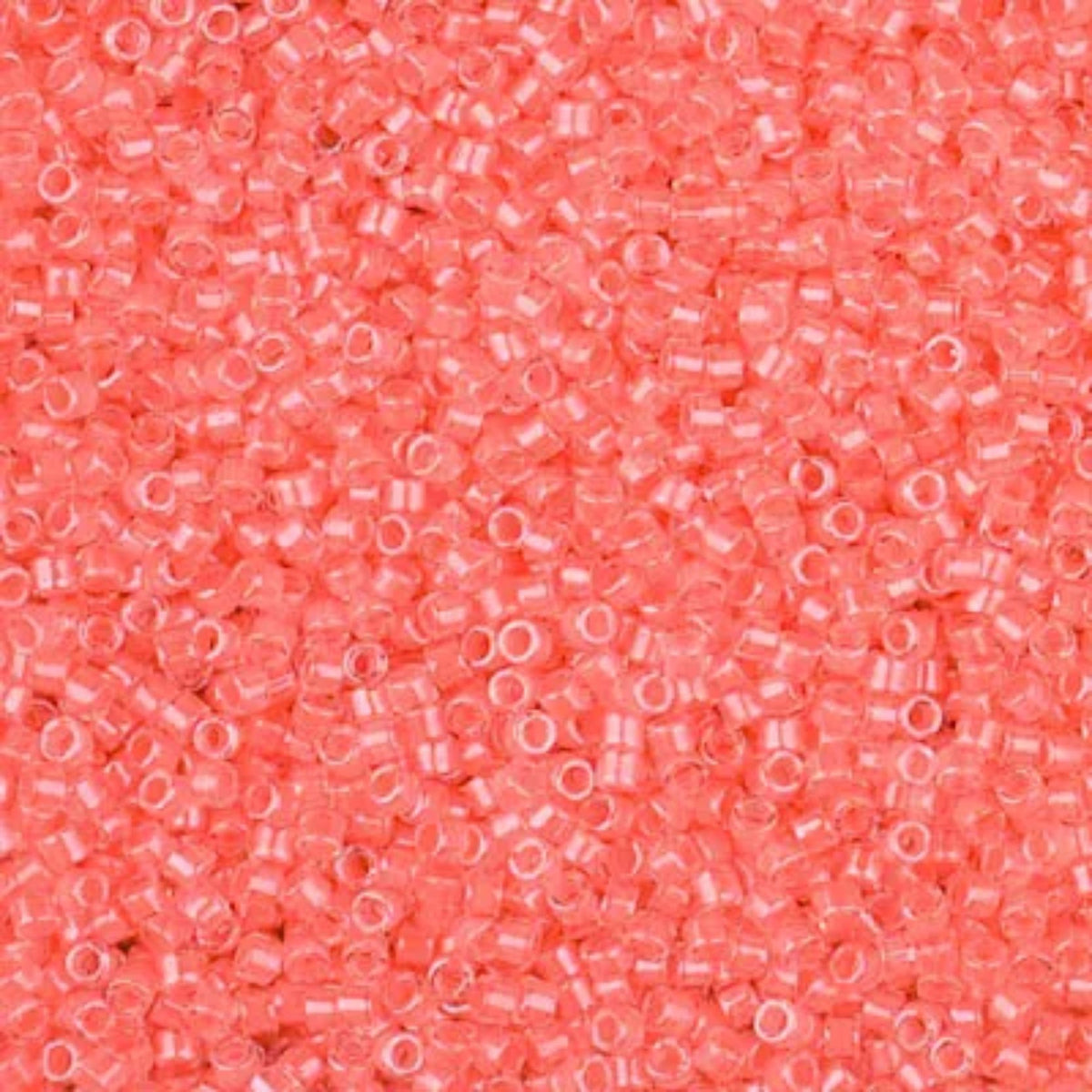 Close-up of Miyuki Delica 11/0 DB2034 cylinder beads in luminous flamingo