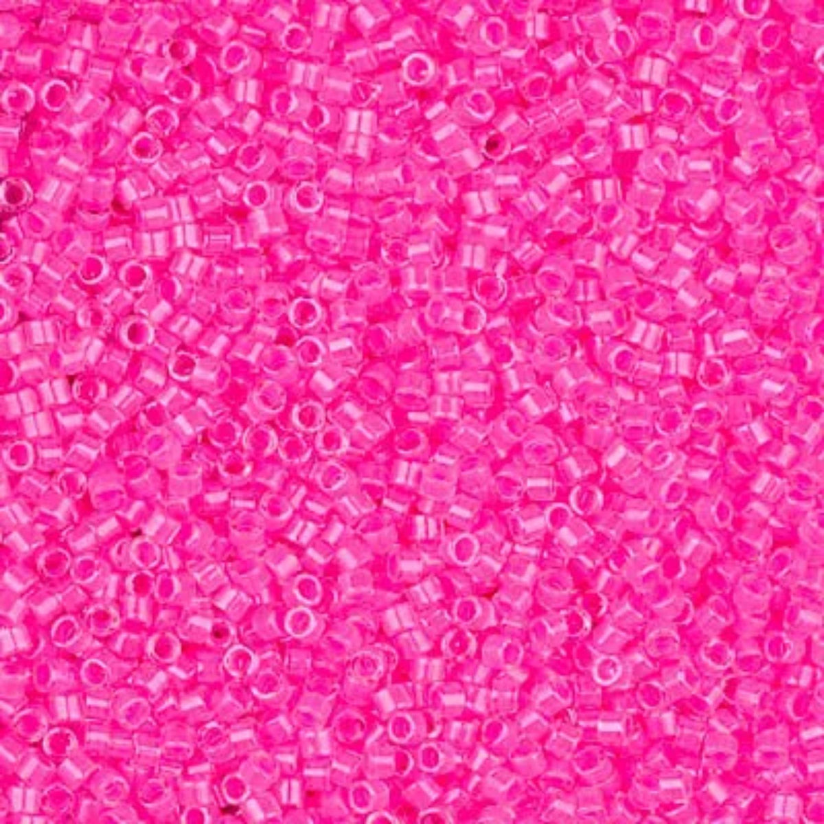 Close-up of Miyuki Delica 11/0 DB2035 cylinder beads in luminous wild strawberry