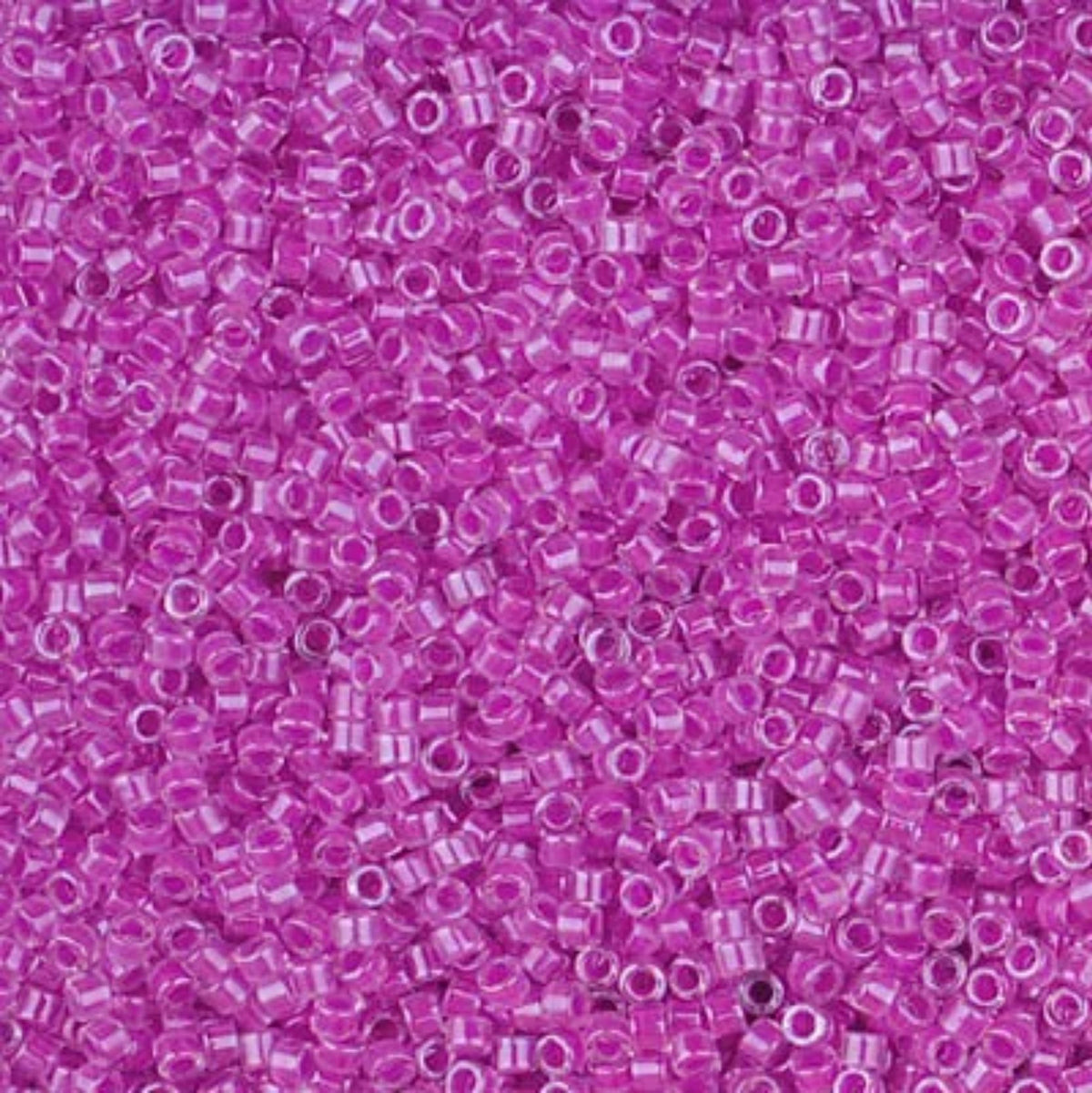 Close-up of Miyuki Delica 11/0 DB2038 cylinder beads in luminous plum crazy