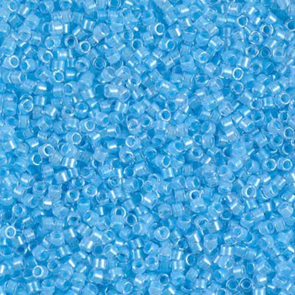 Close-up of Miyuki Delica 11/0 DB2039 cylinder beads in luminous ocean blue