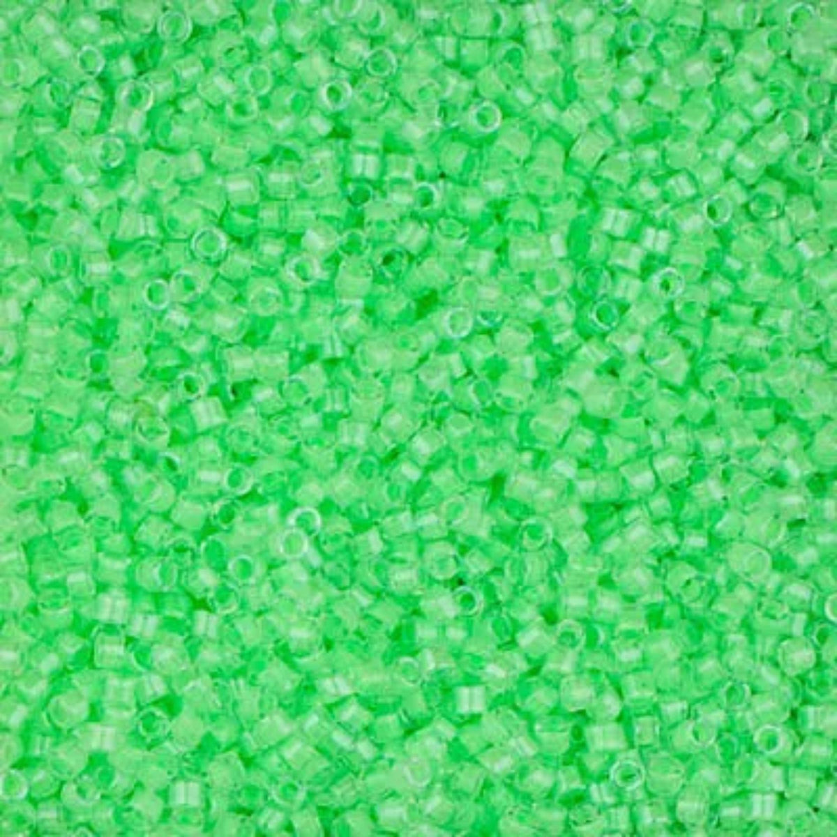 Close-up of Miyuki Delica 11/0 DB2040 cylinder beads in luminous mint green