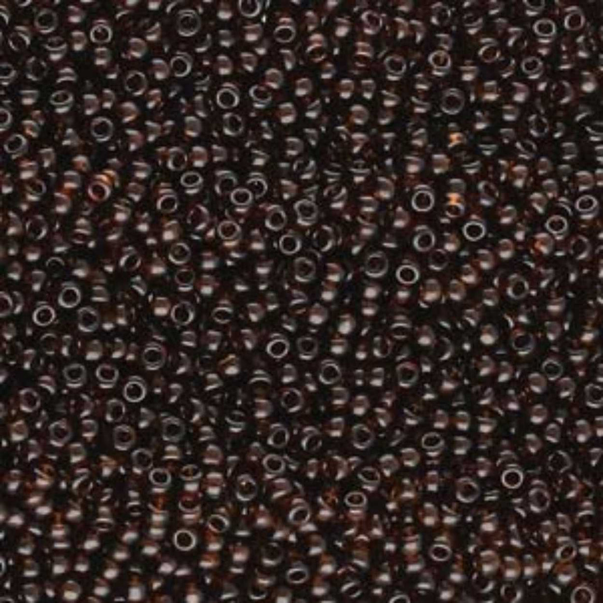 Close-up of Preciosa 11/0 Czech glass seed beads in transparent brown