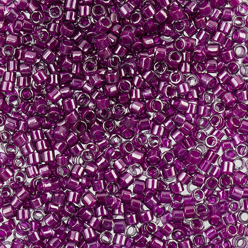 Close-up of Miyuki Delica 11/0 DB0281 cylinder beads in deep plum with a luster finish