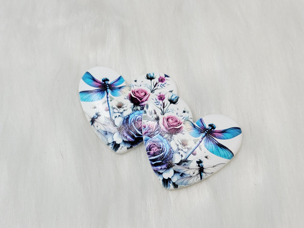 Pair of 37mm resin heart cabochons (cabs) in white with blue dragonflies and pastel roses