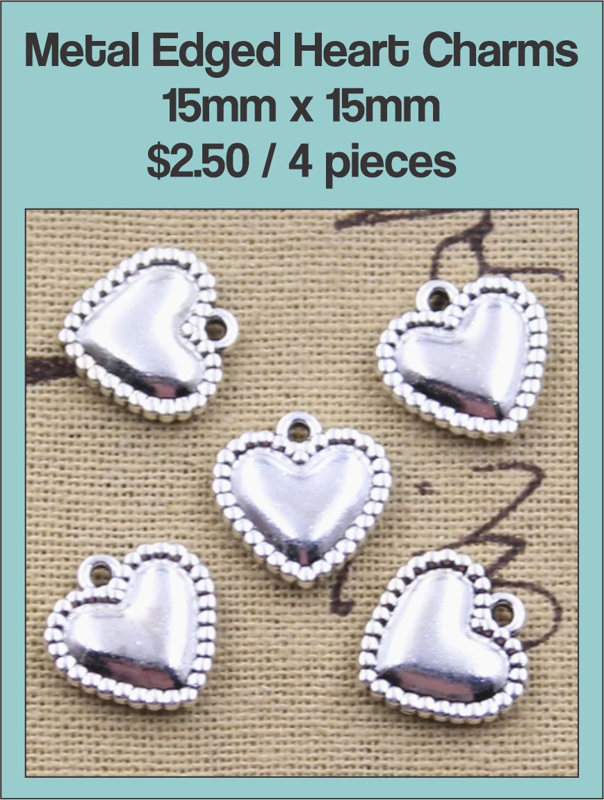 Four silver-tone 15 x 15mm puffed heart charms with a beaded edge