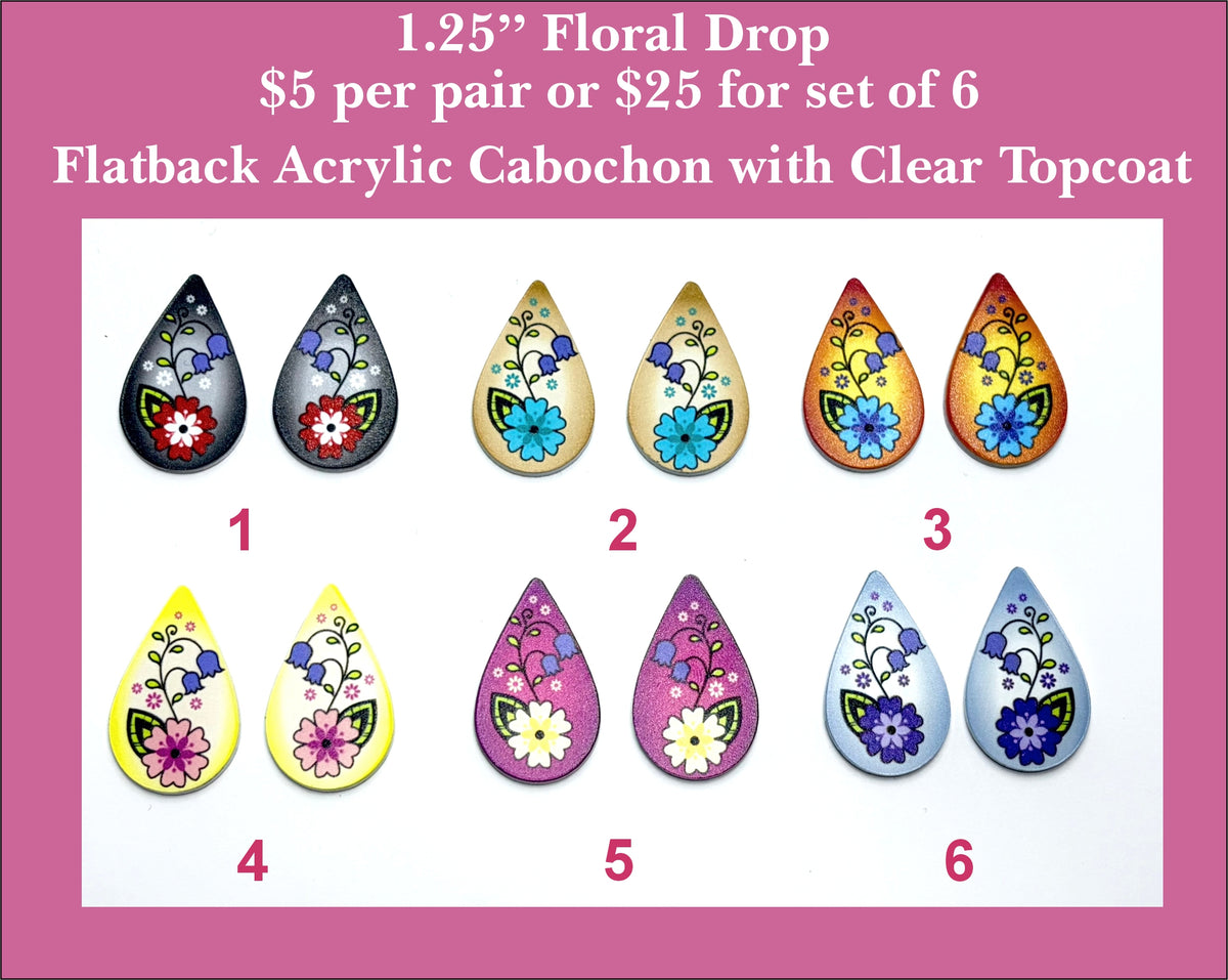 Six pairs of 1.25 inch UV-printed acrylic floral drop cabochons (cabs) in black, cream, gold, pink and blue