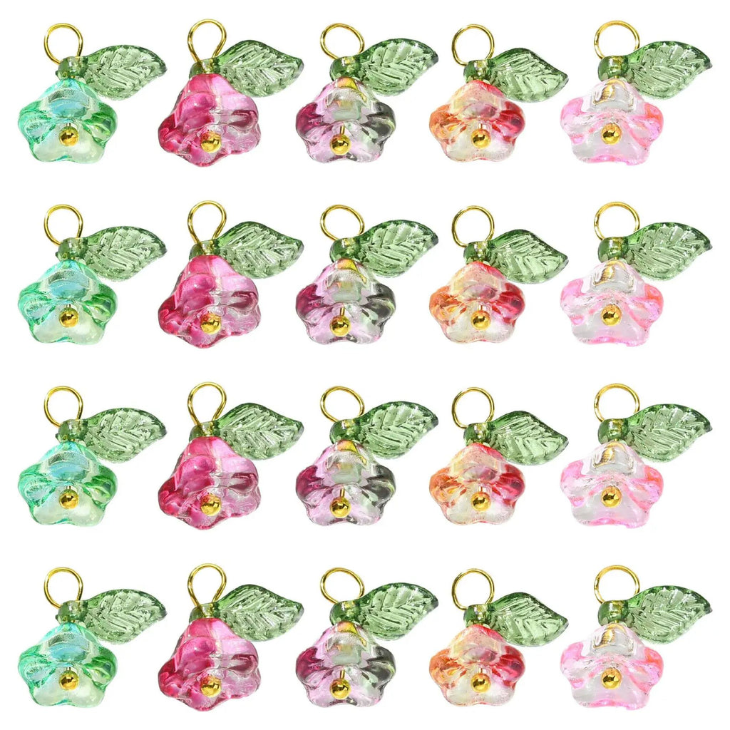 Rows of glass flower and leaf charms in pink, green and red shown in matching sets