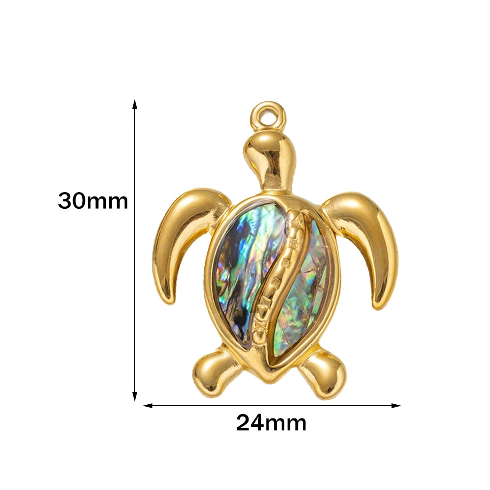 Gold-tone 30 x 24mm turtle pendant with an abalone shell inlay and size markings
