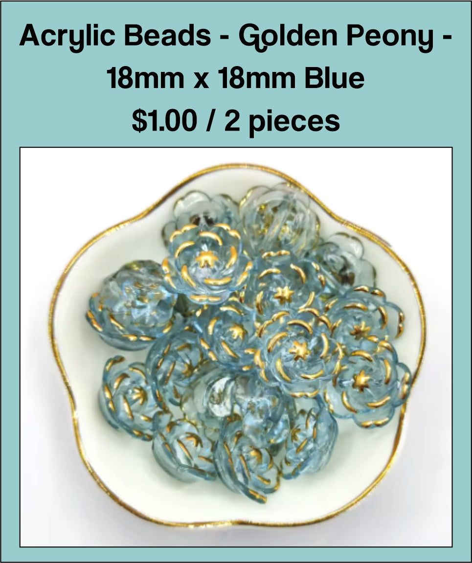 Dish of 18mm blue acrylic peony flower beads with gold-tone edging
