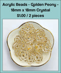 Dish of 18mm crystal acrylic peony flower beads with gold-tone edging